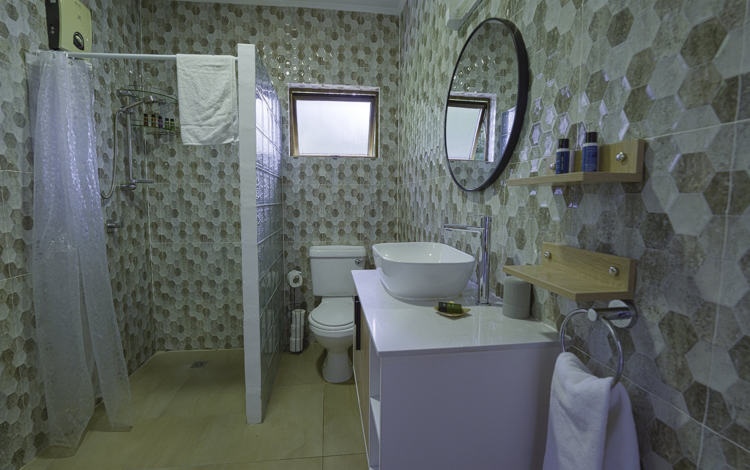 Bathroom with shower and tiled walls