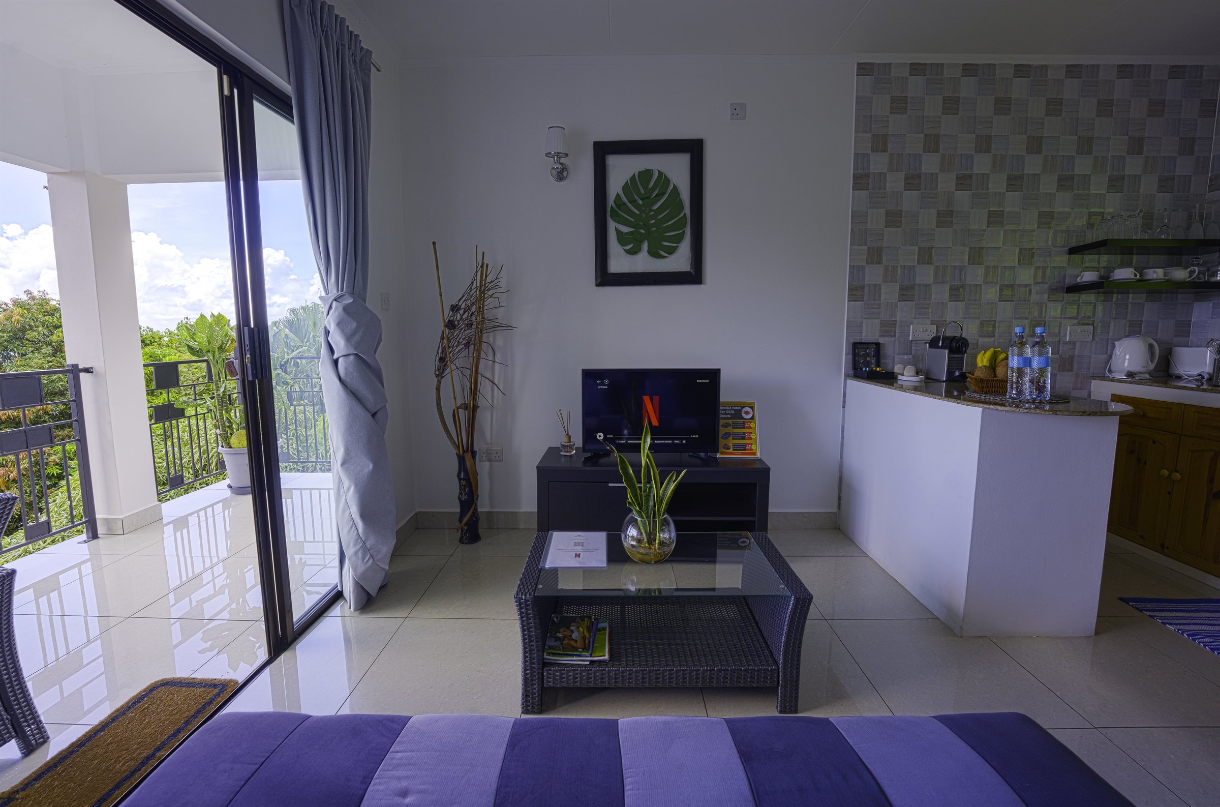 Lounge with balcony doors open to the view